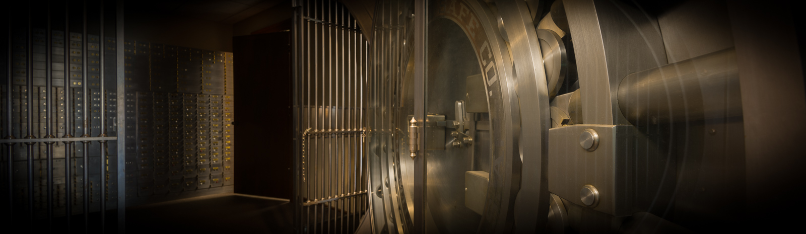 Vault door and wall of safe deposit boxes